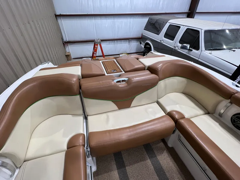 Slide: The Image of 2016 MasterCraft X26 boat interior with tan and cream seating. - 33