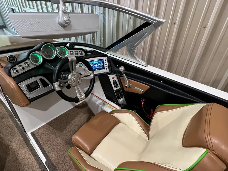 Slide: The Image of 2016 MasterCraft X26 boat interior with modern dashboard and leather seating. - 35