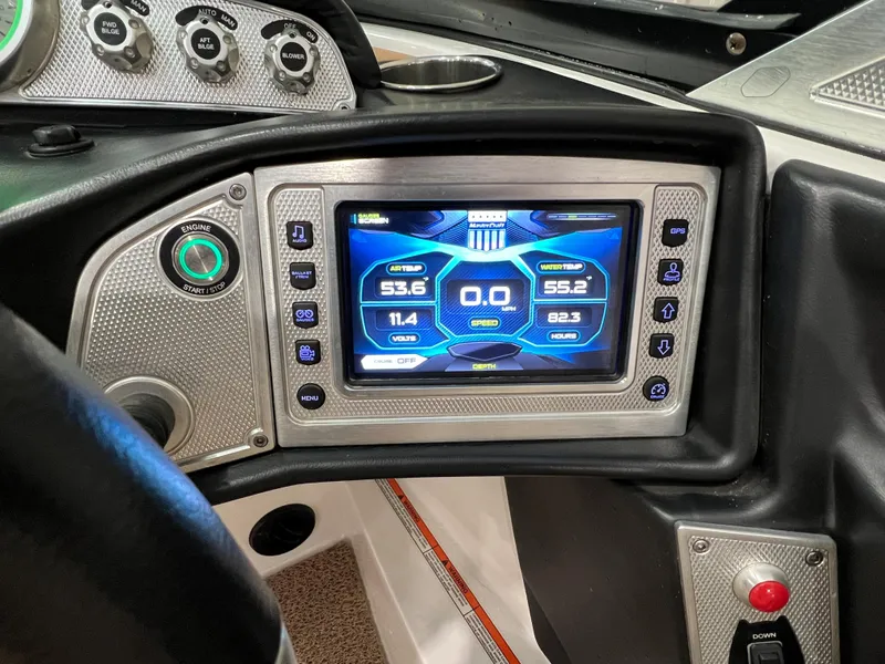 Slide: The Image of 2016 MasterCraft X26 dashboard with digital display and control panel. - 36