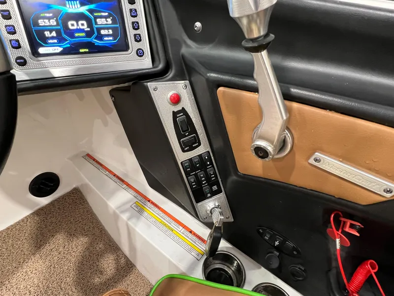Slide: The Image of 2016 MasterCraft X26 boat dashboard with control panel and digital display. - 37