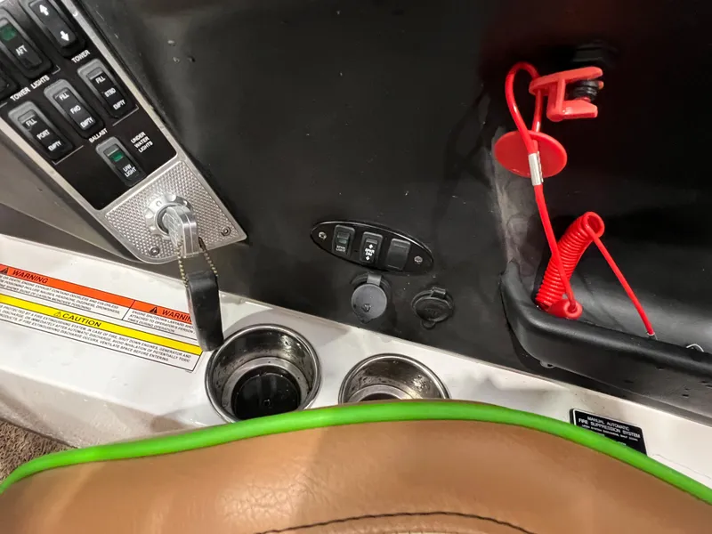 Slide: The Image of Control panel of a 2016 MasterCraft X26 boat with ignition and safety features. - 38