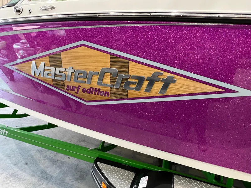 Slide: The Image of 2016 MasterCraft X26 boat with purple glitter finish and "surf edition" logo. - 8