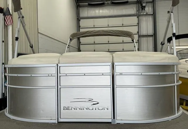 Slide: The Image of 2013 Bennington 2575 R pontoon boat in a garage setting. - 1
