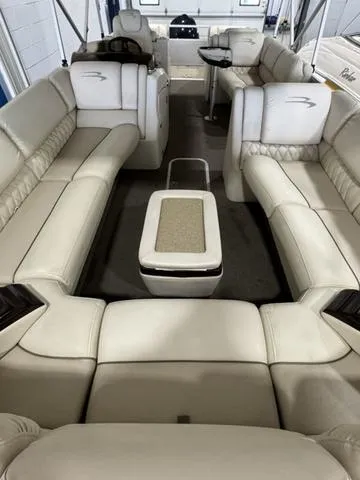 Slide: The Image of 2013 Bennington 2575 R boat interior with luxurious beige seating and table. - 20