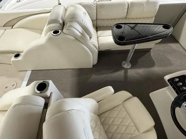 Slide: The Image of Luxurious interior of 2013 Bennington 2575 R pontoon boat with plush seating and table. - 22