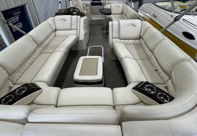Slide: The Image of Luxurious interior of a 2013 Bennington 2575 R pontoon boat with plush seating. - 27