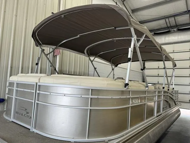 Slide: The Image of 2013 Bennington 2575 R pontoon boat in a storage facility. - 5