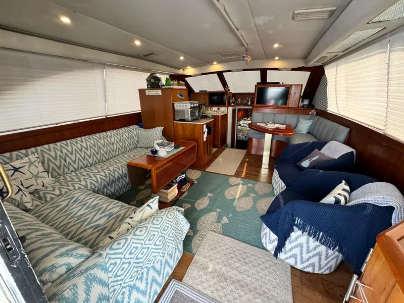 Slide: The Image of Luxurious interior of 1993 Ocean Yachts 42 Super Sport with cozy seating and modern amenities. - 11
