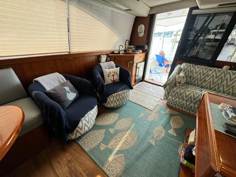 Slide: The Image of Interior of 1993 Ocean Yachts 42 Super Sport with cozy seating and nautical decor. - 14