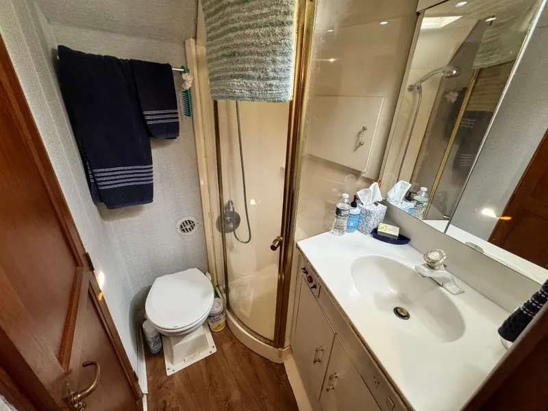 Slide: The Image of Bathroom in 1993 Ocean Yachts 42 Super Sport with shower, sink, and toilet. - 18