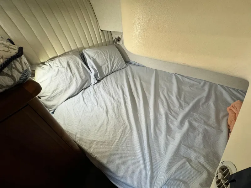 Slide: The Image of Cozy cabin bed inside a 1993 Ocean Yachts 42 Super Sport boat. - 20