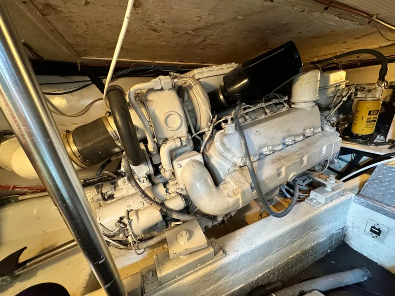 Slide: The Image of Engine room of a 1993 Ocean Yachts 42 Super Sport, showcasing the vessel's powerful engine. - 22