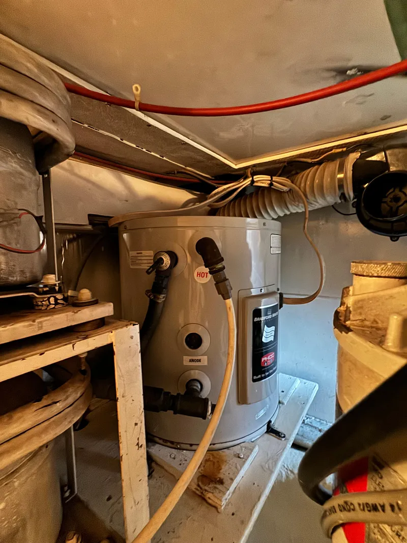 Slide: The Image of Engine room of 1993 Ocean Yachts 42 Super Sport with equipment and wiring. - 24