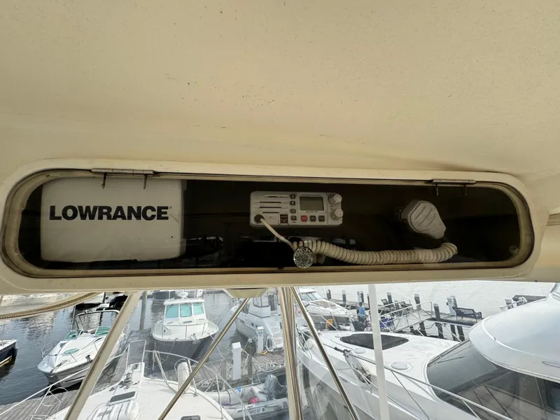 Slide: The Image of 1993 Ocean Yachts 42 Super Sport electronics panel with Lowrance equipment at marina. - 8