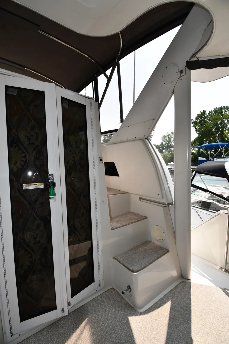 Slide: The Image of 1997 Carver 405 Motor Yacht interior stairs and door detail. - 15