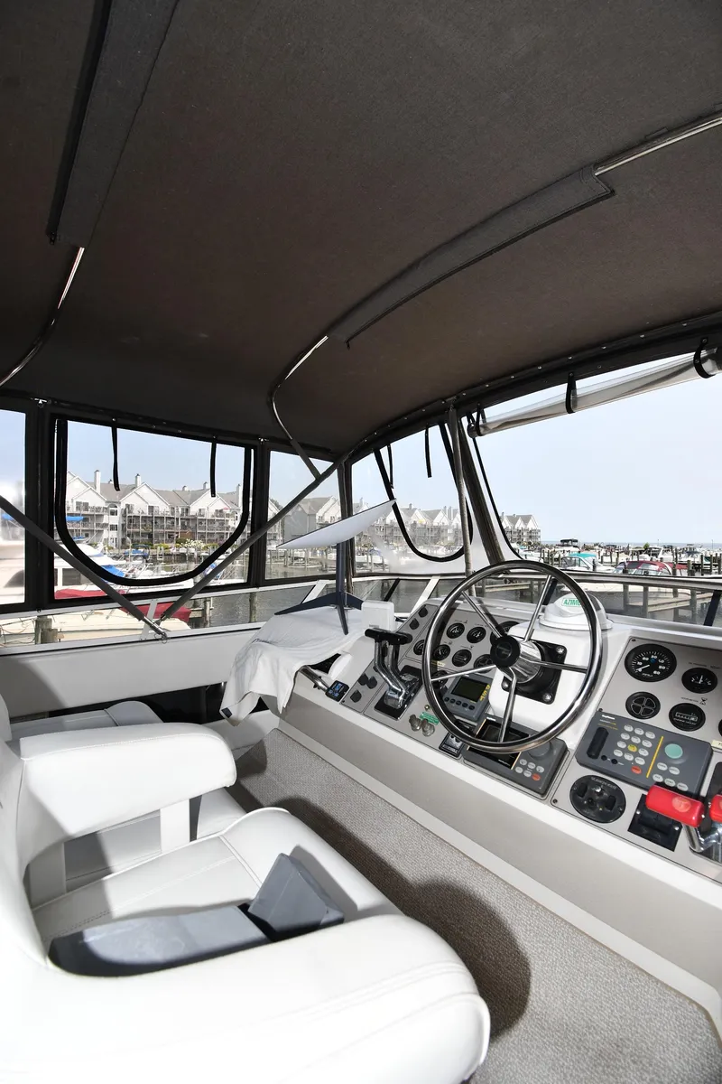 Slide: The Image of Interior cockpit of 1997 Carver 405 Motor Yacht with steering wheel and controls. - 20