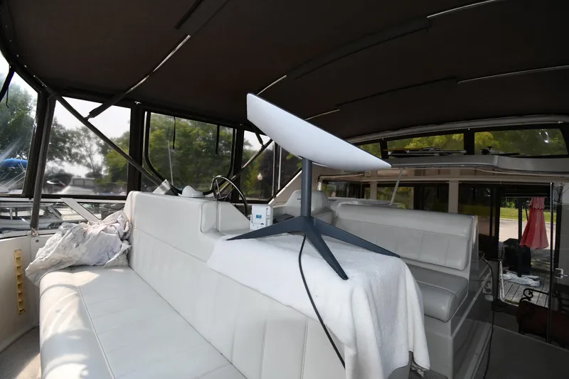 Slide: The Image of 1997 Carver 405 Motor Yacht interior with modern satellite dish setup. - 27