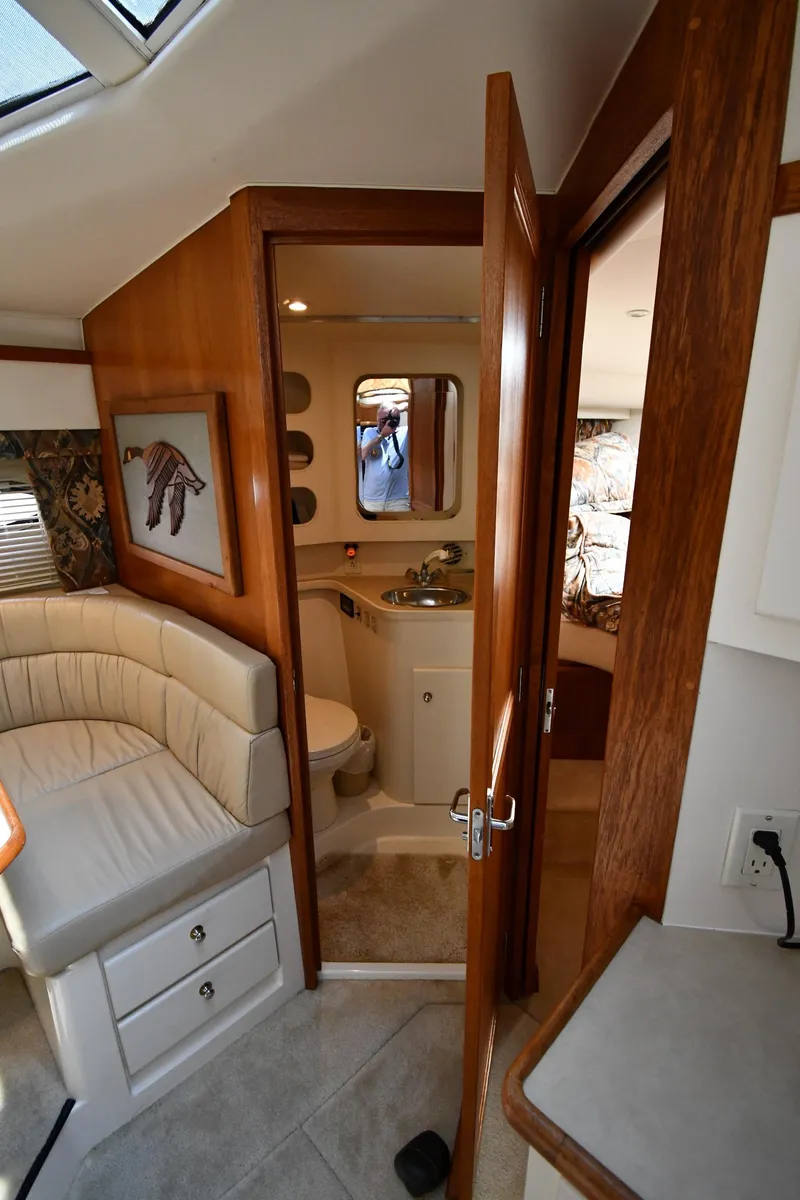 Slide: The Image of Interior of 1997 Carver 405 Motor Yacht with bathroom and seating area. - 39