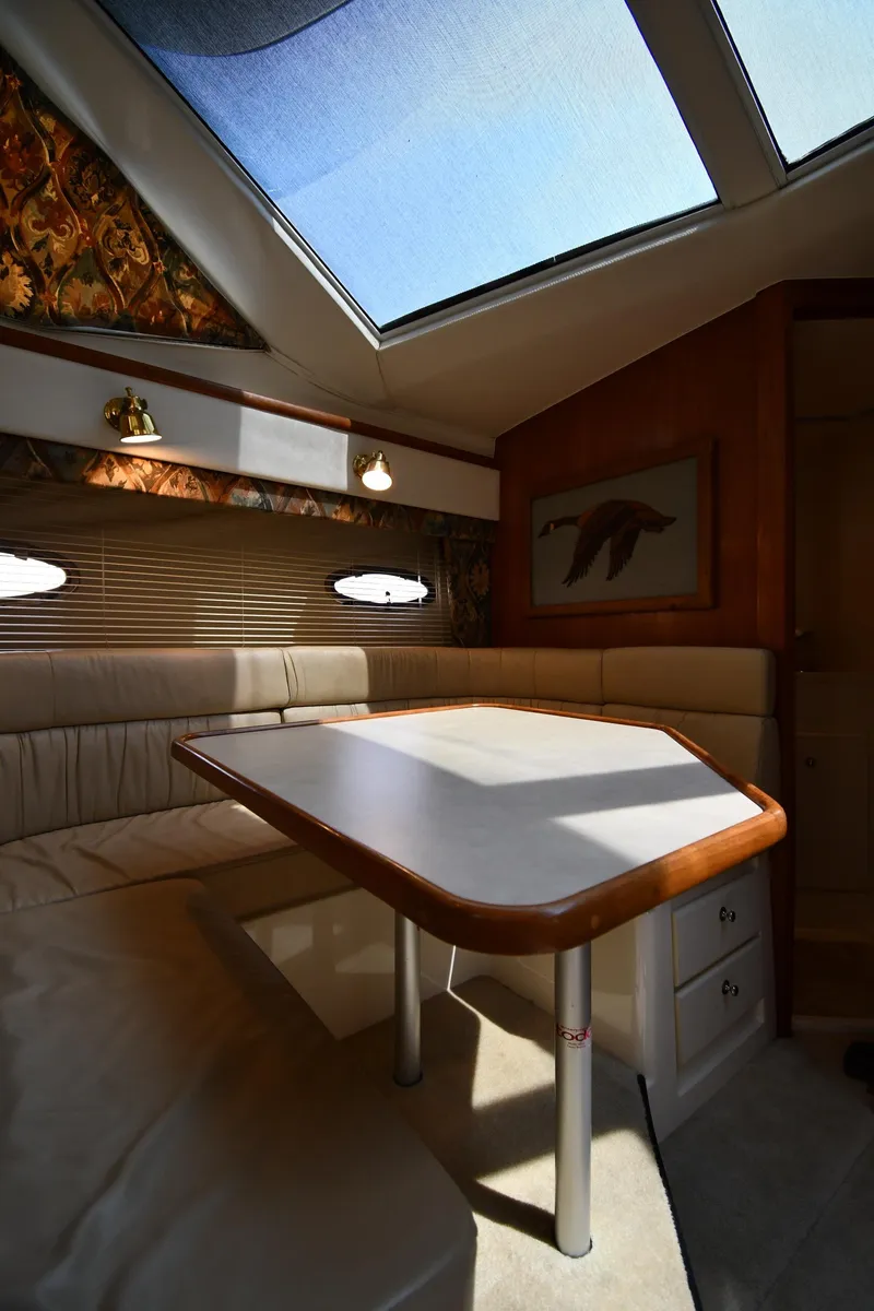 Slide: The Image of Interior of 1997 Carver 405 Motor Yacht with skylight and dining area. - 44