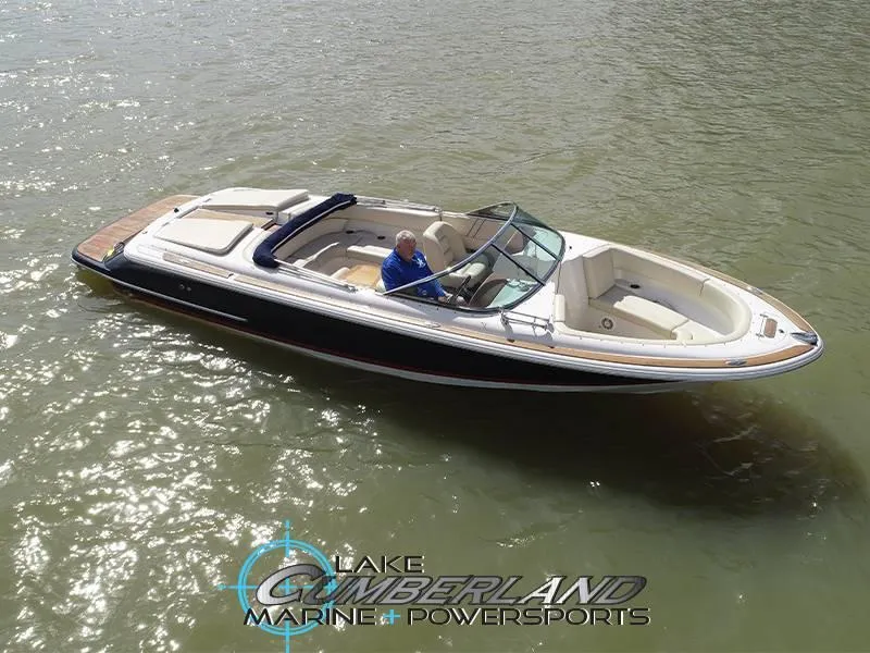 Slide: The Image of 2009 Chris-Craft Launch 25 Heritage Edition boat on water, Lake Cumberland Marine logo visible. - 1