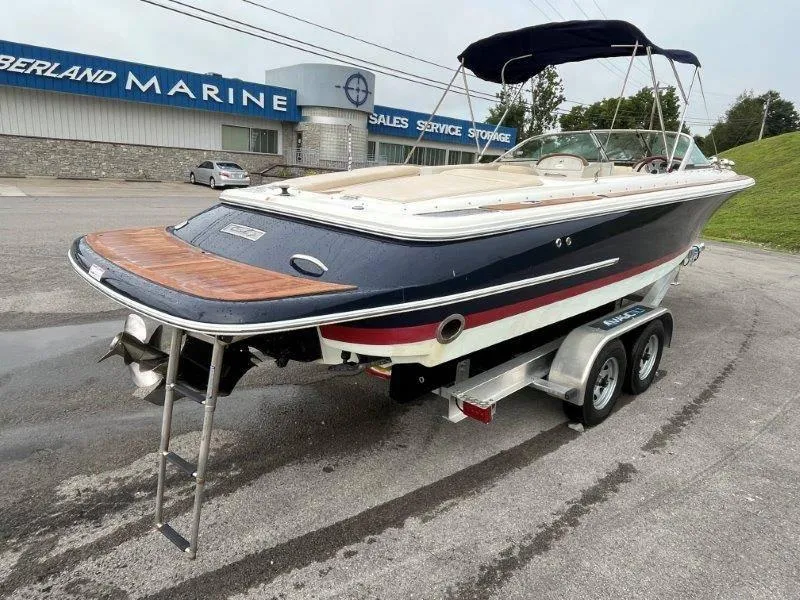 Slide: The Image of 2009 Chris-Craft Launch 25 Heritage Edition boat on trailer at marine dealership. - 10
