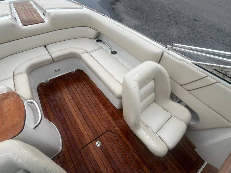 Slide: The Image of Luxurious interior of 2009 Chris-Craft Launch 25 Heritage Edition with white seating and wooden flooring. - 35