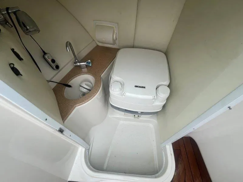 Slide: The Image of 2009 Chris-Craft Launch 25 Heritage Edition boat bathroom interior with sink and toilet. - 37
