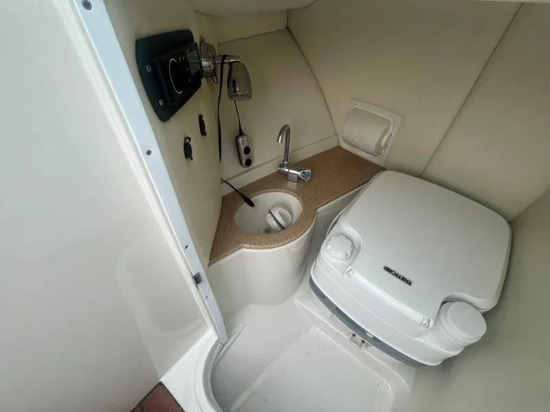 Slide: The Image of 2009 Chris-Craft Launch 25 Heritage Edition boat interior with sink and toilet. - 38