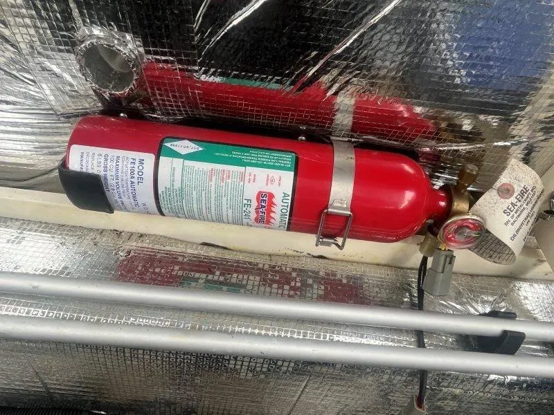 Slide: The Image of Fire extinguisher in 2009 Chris-Craft Launch 25 Heritage Edition boat engine compartment. - 40