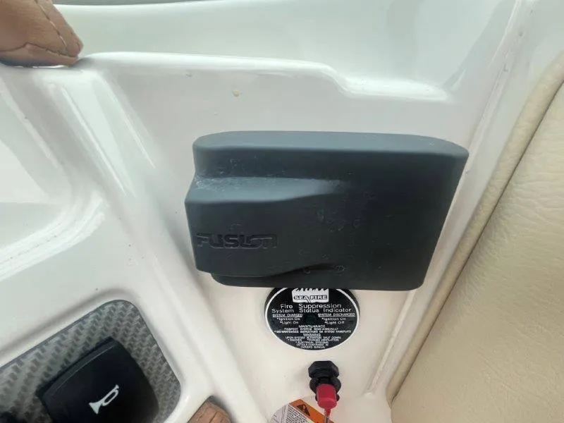 Slide: The Image of Close-up of a 2009 Chris-Craft Launch 25 Heritage Ed dashboard with Fusion audio system. - 45