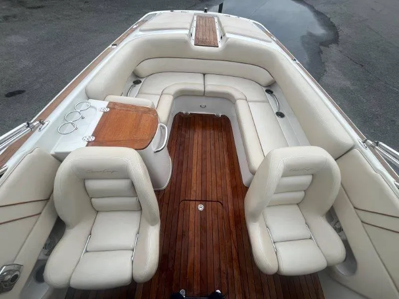 Slide: The Image of 2009 Chris-Craft Launch 25 Heritage Edition boat interior with white seating and wooden flooring. - 50