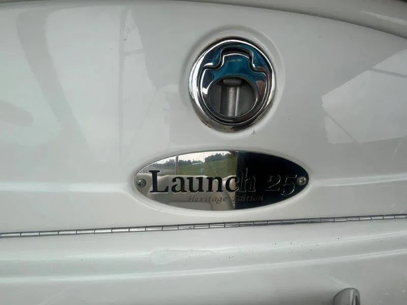 Slide: The Image of 2009 Chris-Craft Launch 25 Heritage Edition nameplate on boat exterior. - 55