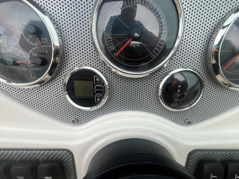 Slide: The Image of Dashboard of 2009 Chris-Craft Launch 25 Heritage Edition with analog gauges and digital display. - 57