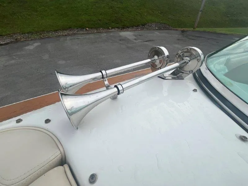 Slide: The Image of 2009 Chris-Craft Launch 25 Heritage Edition boat with dual chrome horns on deck. - 59