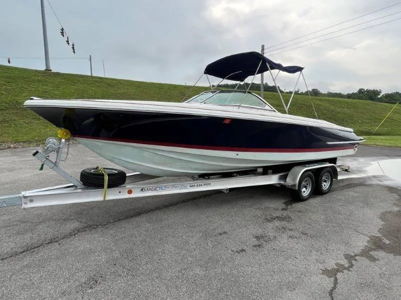 Slide: The Image of 2009 Chris-Craft Launch 25 Heritage Edition boat on trailer, parked outdoors. - 6