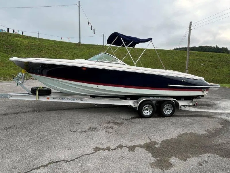 Slide: The Image of 2009 Chris-Craft Launch 25 Heritage Edition boat on trailer, parked outdoors. - 7