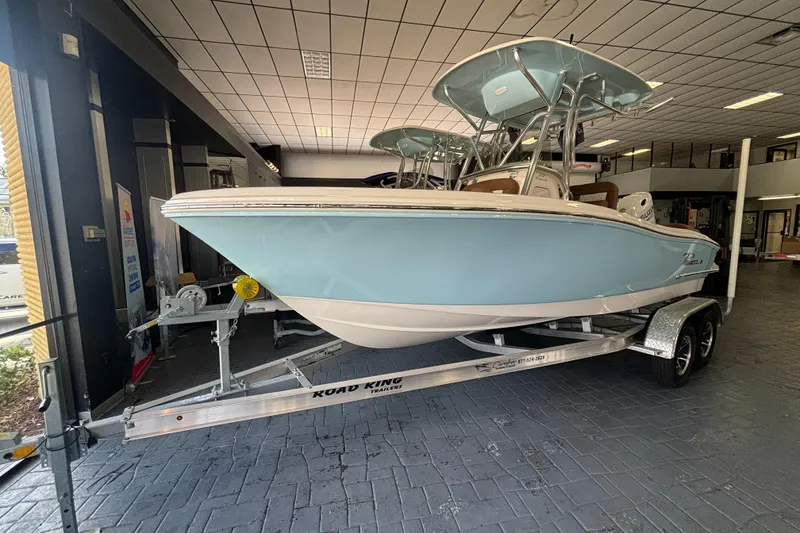 Slide: The Image of 2024 Pioneer 202 Islander boat on trailer in showroom. - 0