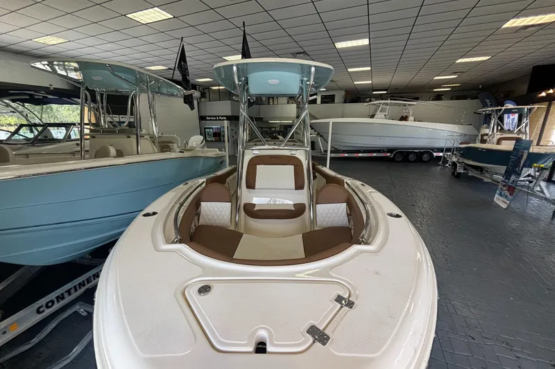 Slide: The Image of 2024 Pioneer 202 Islander boat displayed in a showroom. - 4
