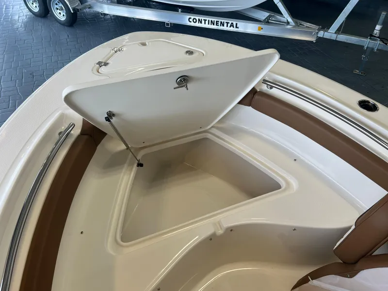 Slide: The Image of 2024 Pioneer 202 Islander boat with open storage compartment, showcasing interior design. - 7