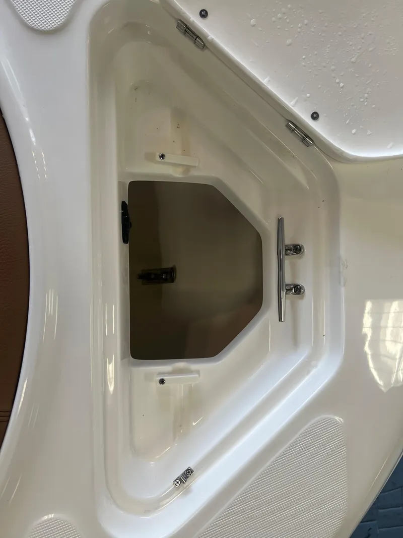 Slide: The Image of 2024 Pioneer 202 Islander boat storage compartment with sleek white finish. - 9