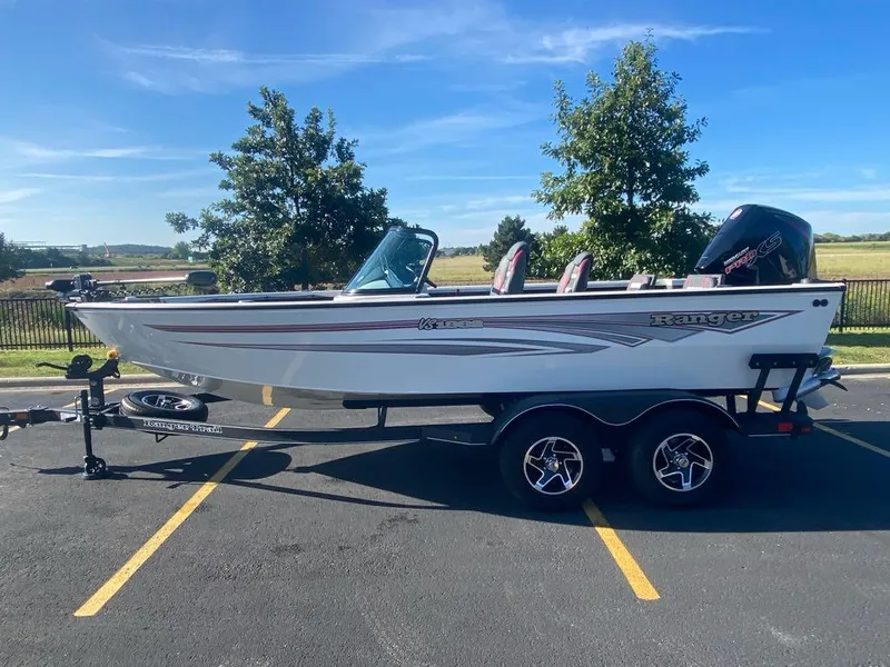 Slide: The Image of 2024 Ranger VS1882SC Reata boat on trailer in parking lot. - 0