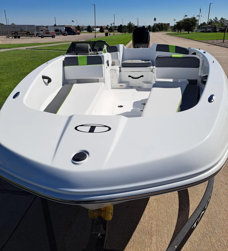 Slide: The Image of 2024 Tahoe T18 boat with sleek design, spacious seating, and modern features. - 2