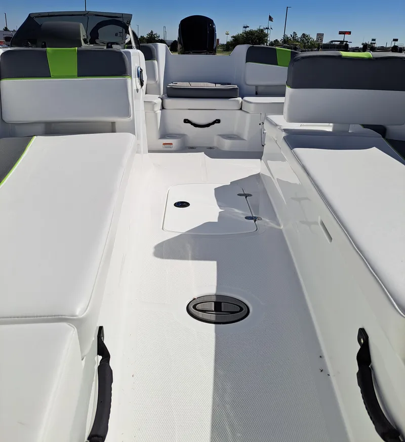 Slide: The Image of 2024 Tahoe T18 boat interior with white seating and green accents. - 5