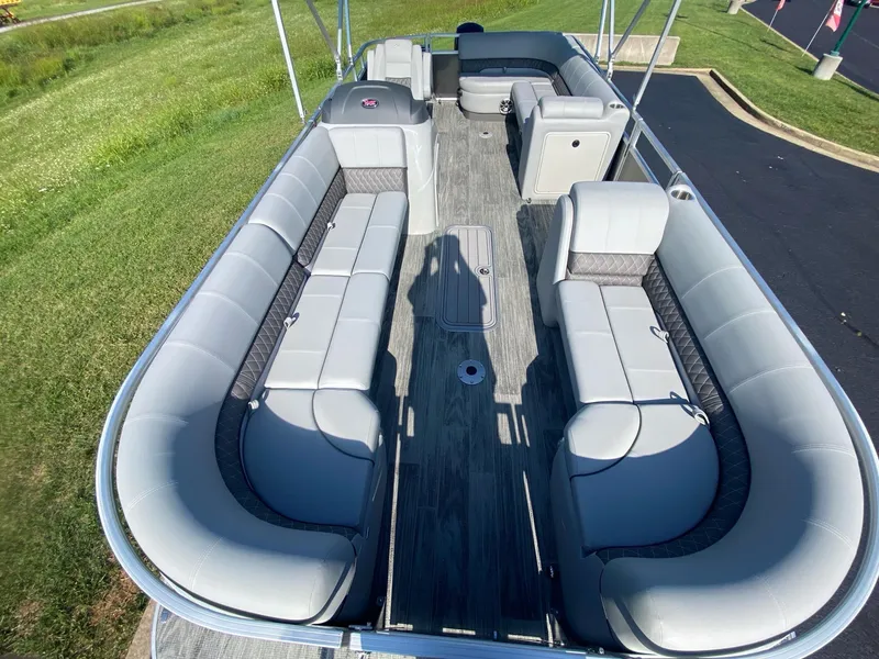 Slide: The Image of 2024 Ranger Reata 223C pontoon boat with spacious seating and modern design. - 8
