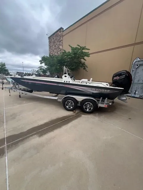 The Image of 2024 Ranger RB200 boat on trailer, parked outdoors near a building. - 0