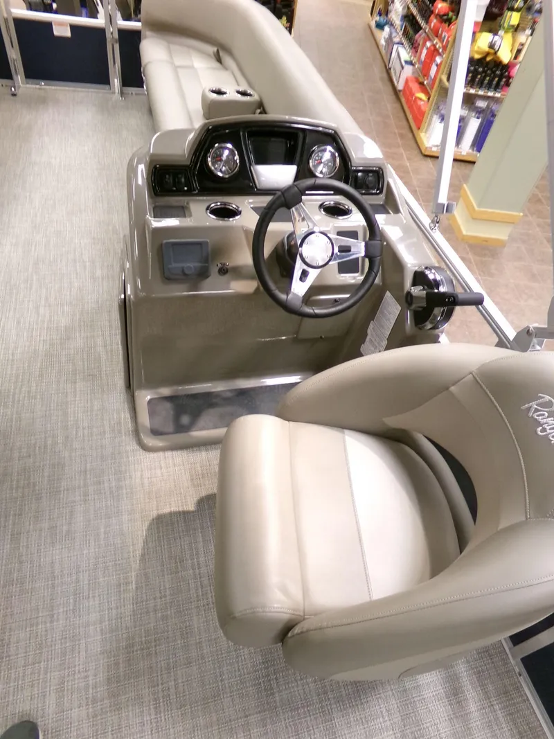 Slide: The Image of 2024 Ranger Reata 200C boat interior with steering wheel and seating. - 4