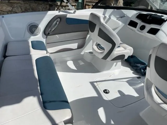 Slide: The Image of 2021 Tahoe TAH500TS boat interior with white and blue seating. - 7