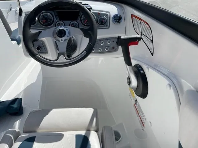 Slide: The Image of 2021 Tahoe TAH500TS boat cockpit with steering wheel and control panel. - 8