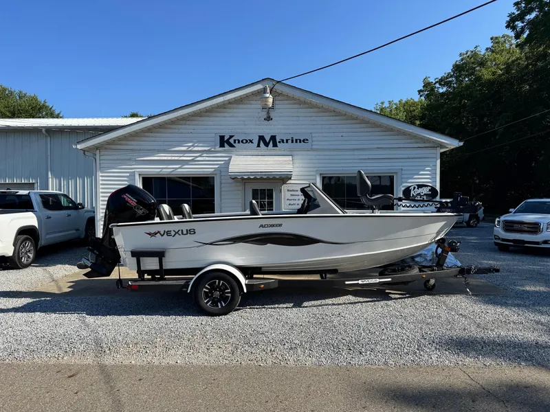 Slide: The Image of 2025 Vexus ADX180LS boat on trailer at Knox Marine dealership. - 1
