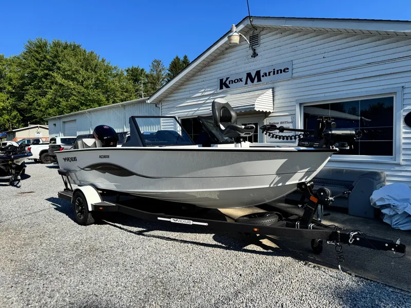 Slide: The Image of 2025 Vexus ADX180LS boat on trailer at Knox Marine dealership. - 2